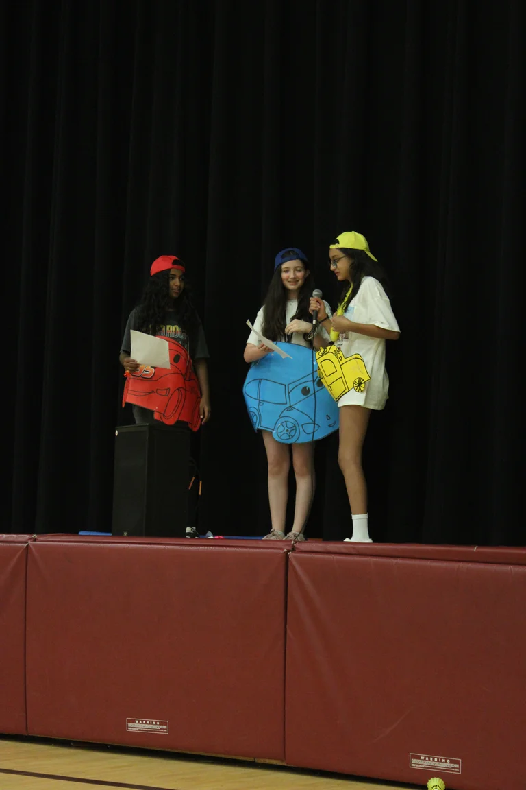 Camp counsellor act out a skit based on the movie cars for campers at Rouge Camps Richmond Hill.