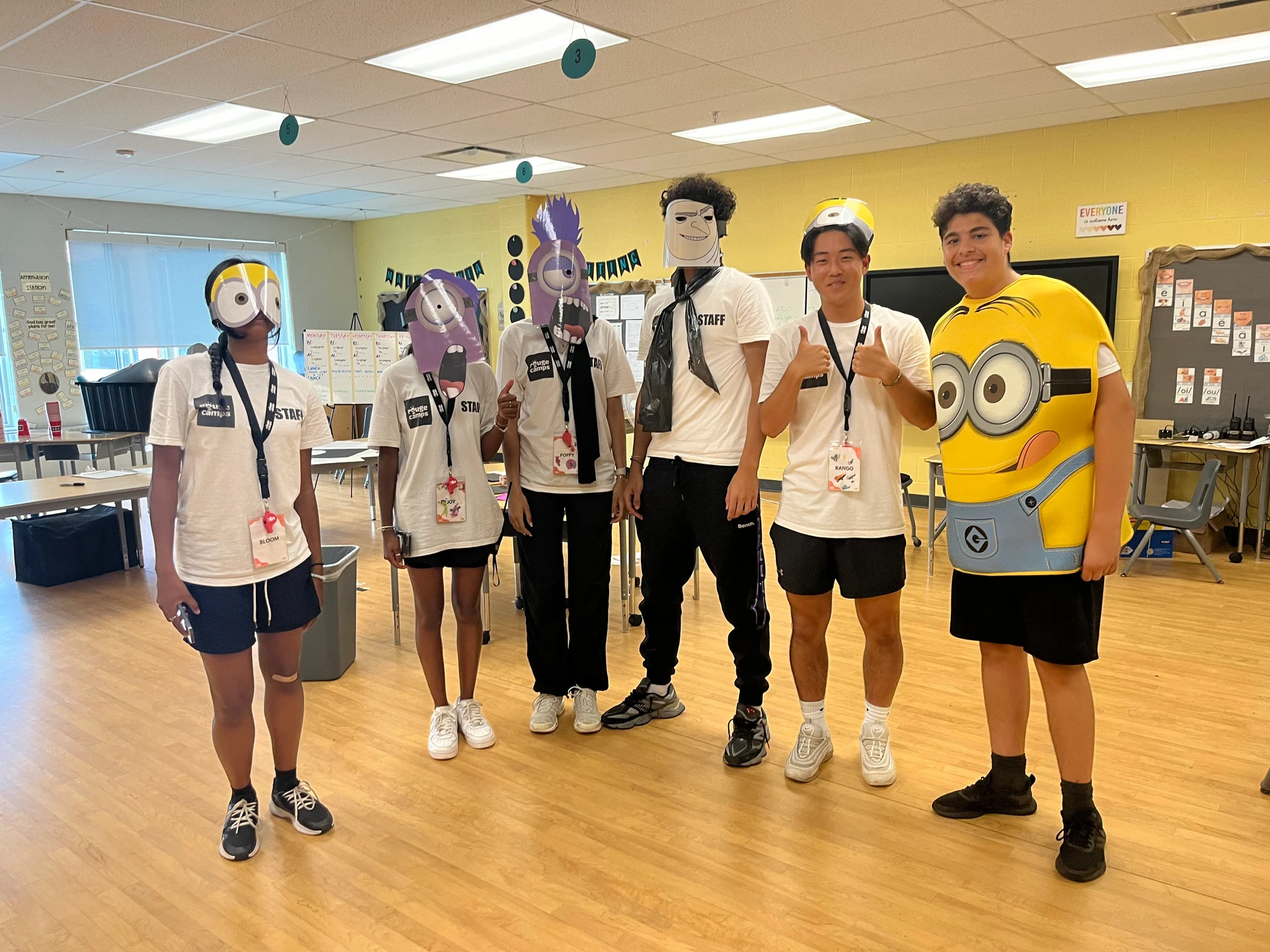 Staff in costume before acting out a minions skit for campers at Rouge Camps Woodbridge.