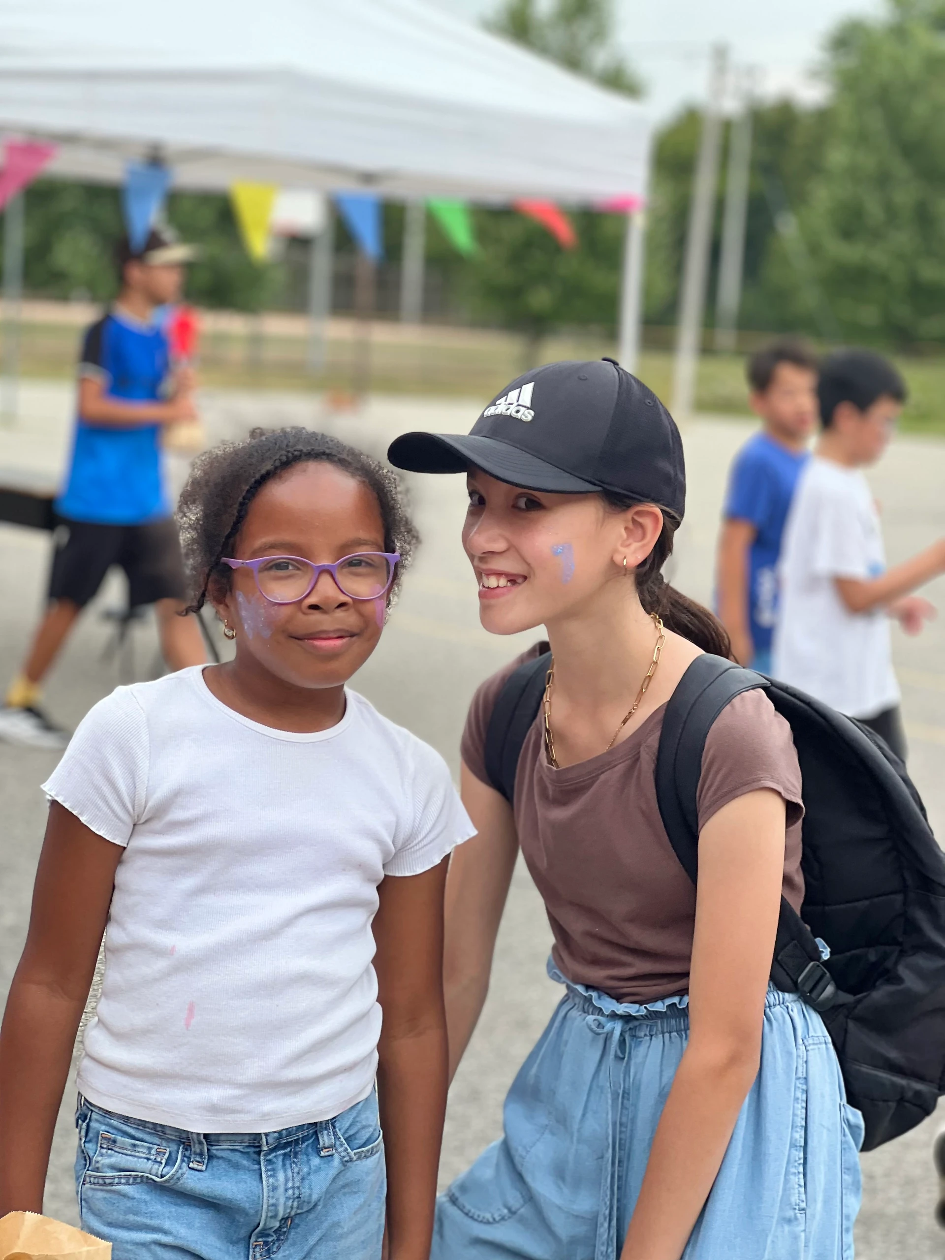 Two female fox campers sharing a moment while having fun at Rouge Camps Unionville.