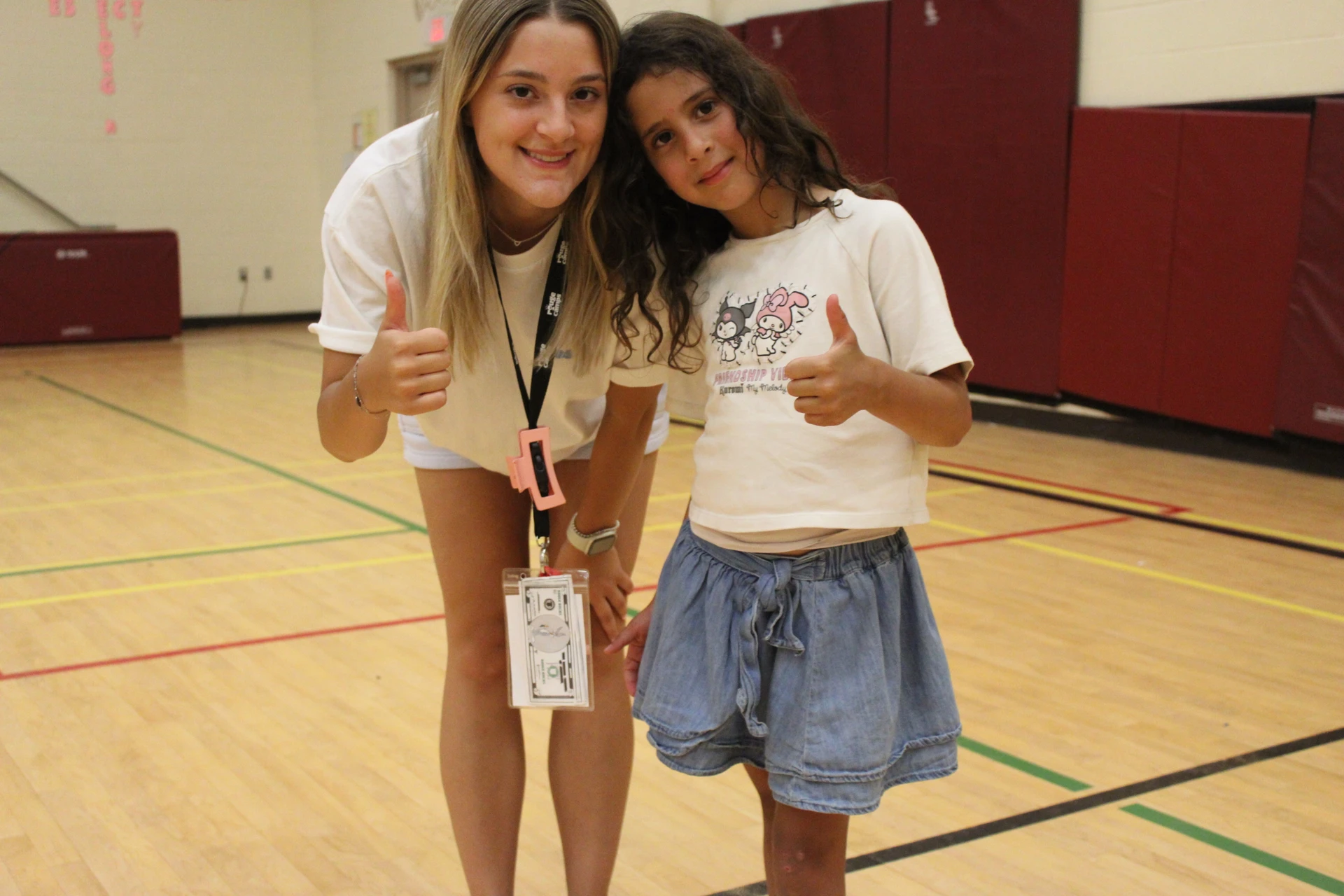 A caring counsellor connects with a camper for a photo at Rouge Camps Richmond Hill.