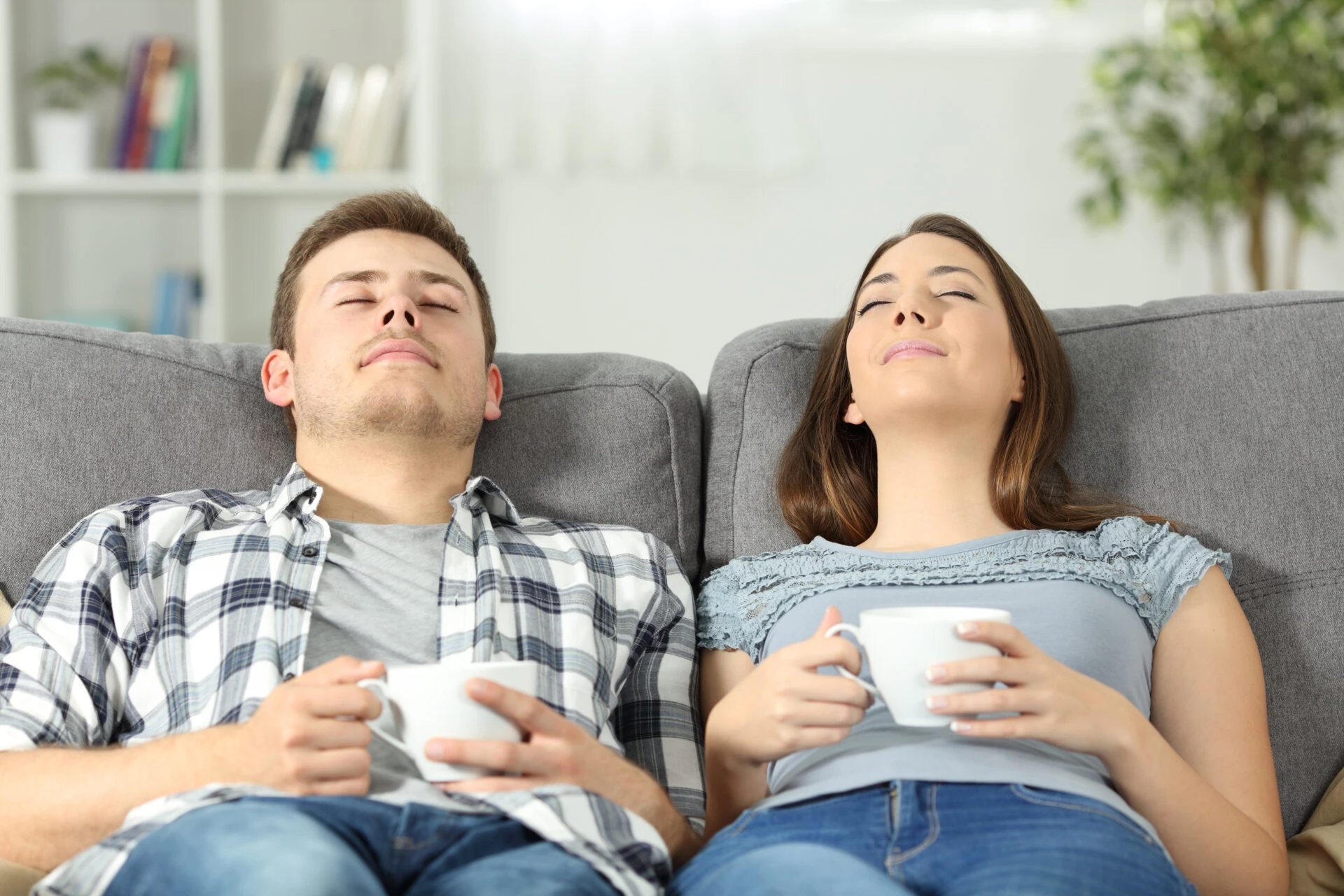 Parents relaxing on the couch having a coffee while their kids are enriching themselves at Rouge Camps.