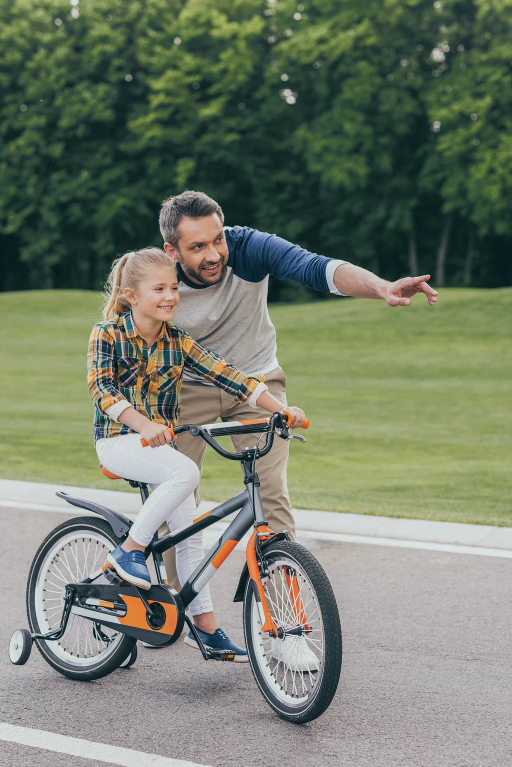 father-teaching-smiling-daughter-riding-bicycle-in-2026-01-05-23-52-59-utc